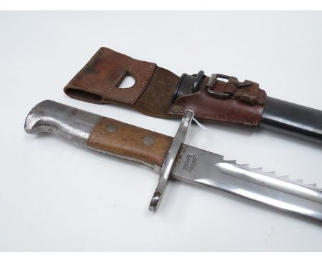 A Swiss M1914 Pioneer sawback bayonet for the 7.5mm Schmidt Rubin M1911 carbine, swell point blade, single fuller with steel 