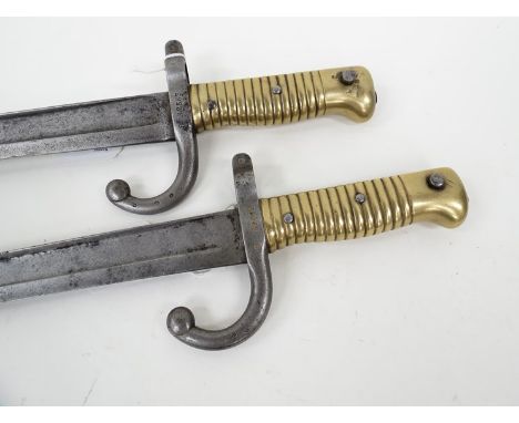 Two late 19th Century French Chassepot sabre bayonets including 1871 dated, one with scabbard 