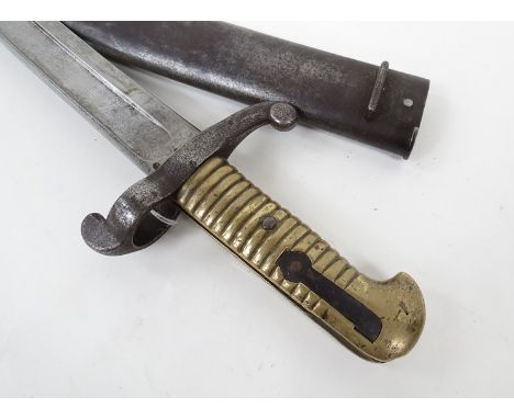 An 1842 Yataghan sword bayonet with steel crossguard, all-steel scabbard, ribbed brass grip, blade edge dated 1853