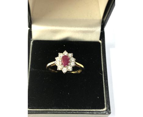 18ct gold ruby and diamond halo ring weight 3.7g, overall good condition,  marked G750 0.50 