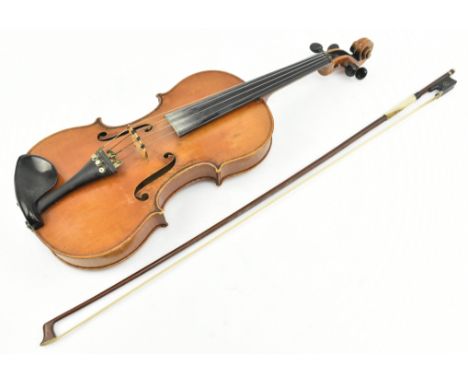 Guarneri family - a 19th century two piece back violin labelled for Joseph Guarneri. The violin of typical form accompanied b