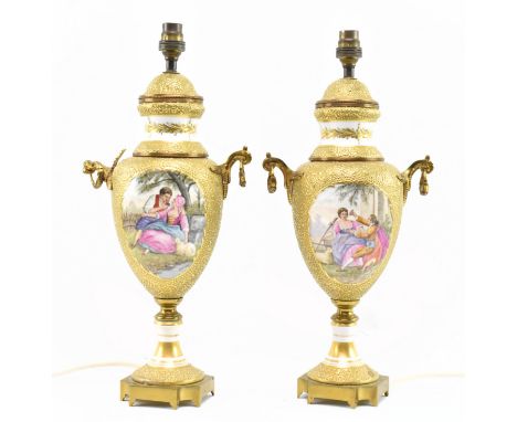 A pair of vintage 20th century gilt enamelled urn shaped lamps. Each lamp with gilt relief enamel detailing, of urn shaped fo