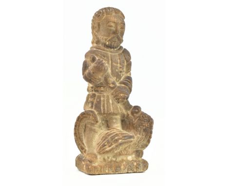 A carved stone figure of St. George slaying the dragon, believed 17th or 18th century. The statue having detailed carving to 