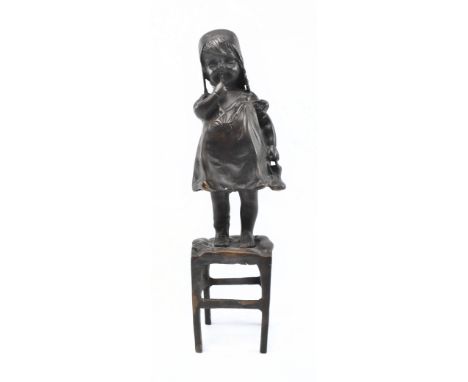 After Juan Clara (Spanish, 1875-1957) - Suzette on a Stool - a 20th century bronze sculpture of child holding a shoe on top o