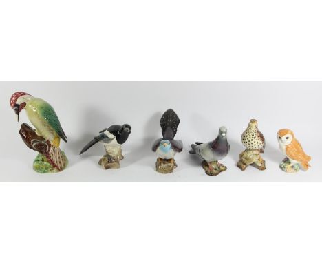 Six Beswick ceramic birds to include, Song thrush (2308) 14cm, Pigeon (1383B) 15cm, Magpie (2305) 13cm, The Cuckoo (2315) 12c