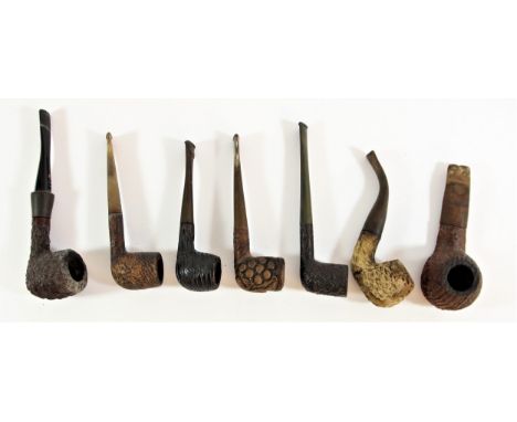 Dunhill, a textured textured brier pipe, together with six other textured pipes, to include Reject, Carey and Parker (6) 