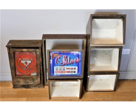 A wall mounted half penny slot machine, lacking glass, apparently complete, 65 x 44 x 18cm, five top boxes, one with Teddy's 