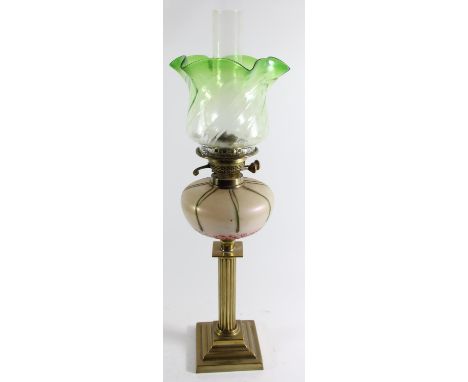 An Art Nouveau glass and brass oil lamp, the iridescent bowl in the manner of Loetz, reeded column to a square base, green gl