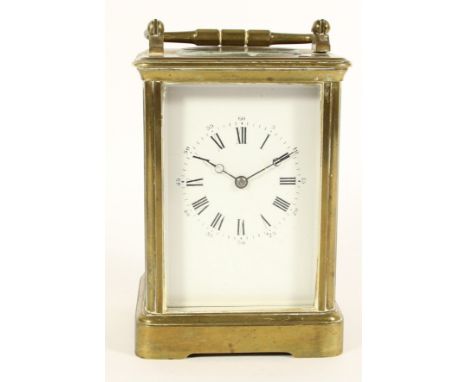 A brass striking carriage clock, white enamel dial, the unsigned movement, numbered 18909, striking the hours and half, on a 