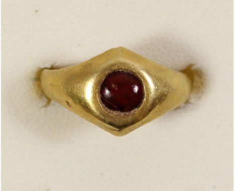 A gold ring inset with a cornelian, possible Roman in origin, size C, 2.7gm.Electronically tested as high carat gold 