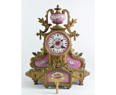 A 19th century French ormolu and porcelain 8 day mantle clock, white enamel dial, the movement by Vincent & Cie, striking on 