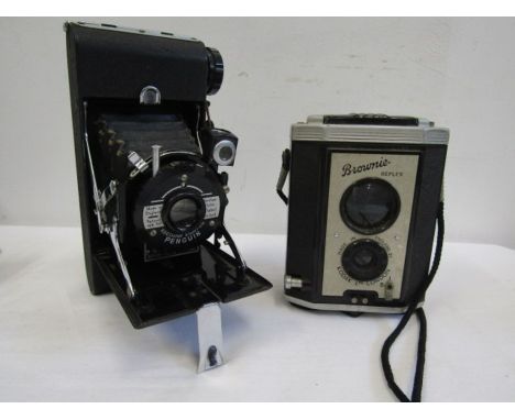 A vintage Kershaw eight-20 Penguin camera and a Kodak Brownie