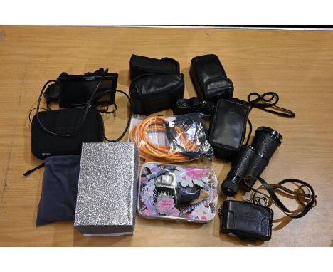 Group of 8 cameras, one tape recorder, AKG headphone set. USB cables, Garmin SAT NAV and one monocular.