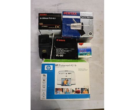 Box containing, HP Photosmart A516 Photo printer, Boxed Pentax Optio MX4, Sigma 18-200mm lens, Canon VL-20 Battery video ligh