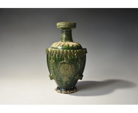 An undated archaistic green-glazed ceramic vase with flared base, bulbous body, deep shoulder, ribbed neck and socket rim; th