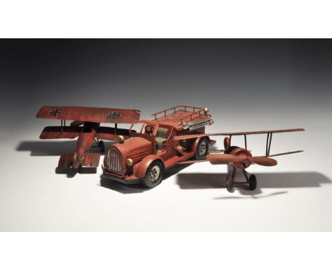 20th century AD. A mixed group of 'retro' sheet metal toys comprising: two WWI vintage biplanes with rotating propellers; a f