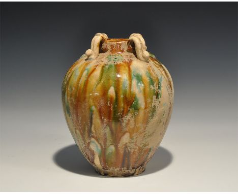 20th century AD. A ceramic crackle-glazed bulbous jar with low rim, four bifid straps and applied rosettes to the shoulder. 9