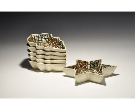 19th century AD. A group of six glazed ceramic Persian spice dishes, five shoe-shaped and one star-shaped, each with a floral