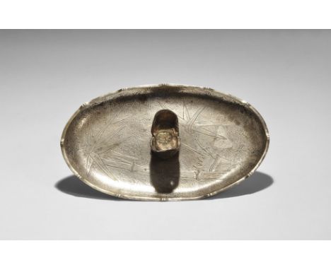 20th century AD. An oval silver trinket tray, possibly plated, with maker's and other marks to underside, with an 18th centur
