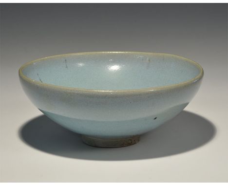 Northern Song-Yuan Dynasties, 960-1368 AD. A pale blue glazed ceramic bowl with low basal ring. 485 grams, 18.5cm (7 1/4"). E