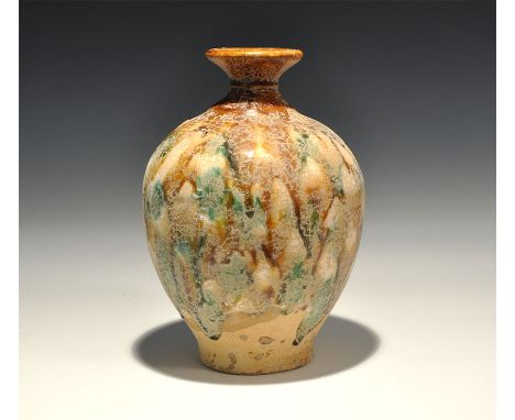 20th century AD. A ceramic crackle-glazed piriform jar with flared rim. 726 grams, 18.5cm (7 1/4"). Acquired on the London ar
