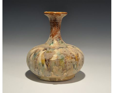 20th century AD. A ceramic crackle-glazed squat jar with tall neck and flared rim. 805 grams, 17cm (6 3/4"). From a central L