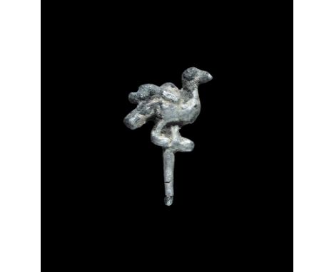 12th-13th century AD. A silver-gilt D-section hooked mount with finial in the form of an advancing bird with raised head. 2.0
