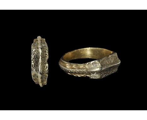 15th century AD. A D-section silver-gilt hoop with raised median rib to the outer face with stamped annulets; the shoulders f