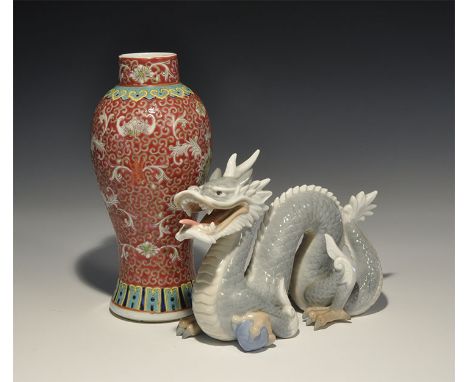 20th century AD. A mixed group comprising: a hollow-formed glazed ceramic dragon with pearl beneath one foot; a glazed cerami