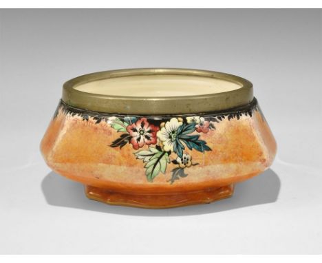 20th century AD. A white-glazed cushion-shaped bowl with brass rim, 'Floral Lustre' or similar pattern; stamped to the unders