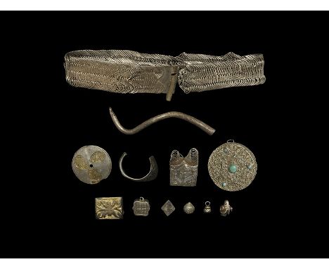 12th-18th century AD. A mixed group of silver items comprising: a flat-section wire bracelet and detached end; a discoid plaq