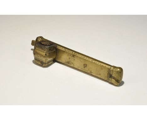 19th century AD. A rectangular-section pen box with chamfered edges, hinged lid with knop finial, lateral barrel-shaped inkwe