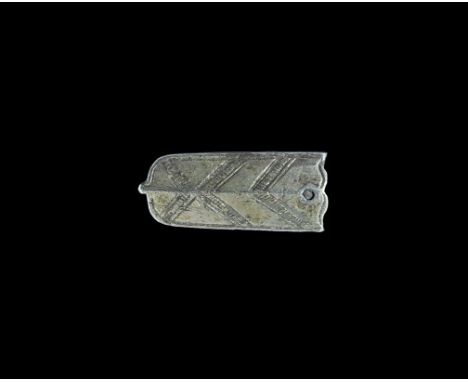 14th-16th century AD. A hollow fabricated silver-gilt strap end, tongue-shaped with knop finial; keeled upper face with hatch