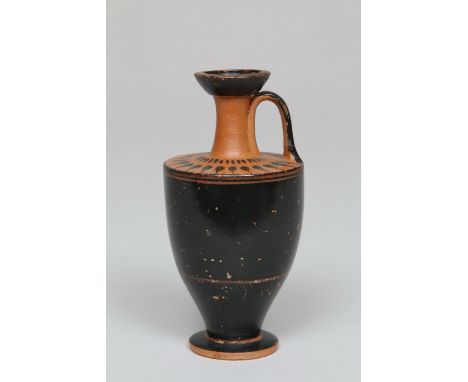 Greek, Attic, lekythos, ca. 470 BC A black painted lekythos with on the earthenware color shoulder black lanceolate leaves wi