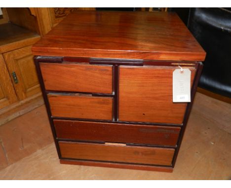 A 20th century mahogany shelf unit, having an arrangement of five drawers, H: 67cm, W:60cm 