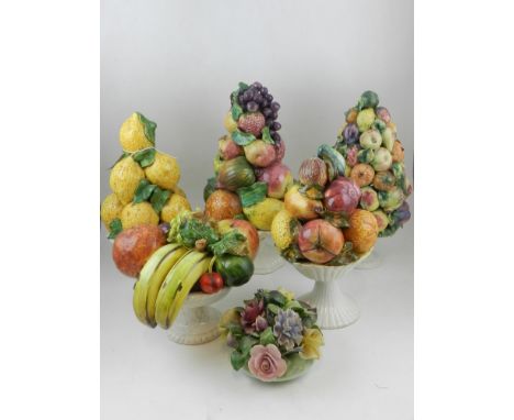 A collection of five various Capo di Monte style ornaments designed as baskets of fruit, together with a ceramic study of flo