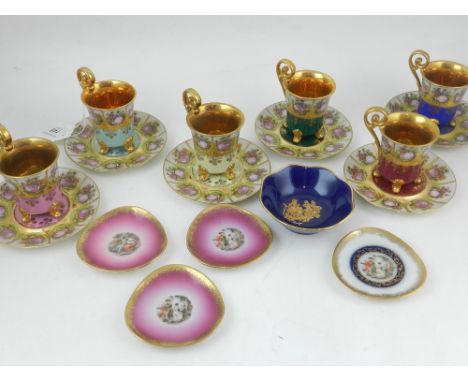 Six Vienna porcelain cabinet plates and saucers, the border decorated with vignettes of figures in landscape, gilt interior, 