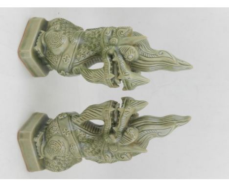 A pair of Chinese celadon ceramic temple guardians. H.28cm
