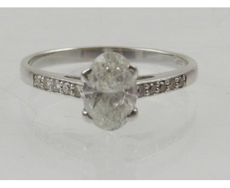 A 14 carat white gold and solitaire diamond ring, central stone of approx. 0.8 carat.