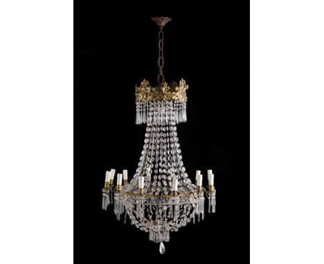 Twelve light balloon chandelier in golden sheet metal with crystal drops. Tuscany. Early 19th century. Defects. 90x77 cm appr