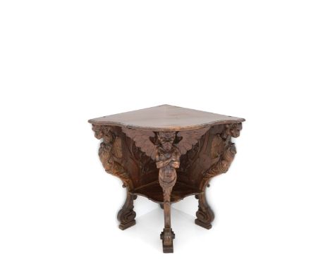 Corner console in carved walnut with legs in the shape of fantastic animals. Southern Italy. 19th century. Minor defects. 89x