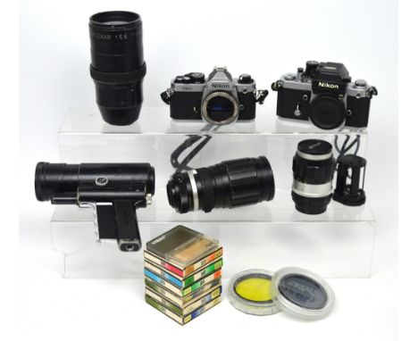 A Nikon FM2 camera body serial no.7422964, with Nikkor-Q 135mm lens, a further Nikon camera body, a Novoflex 400mm lens, a So