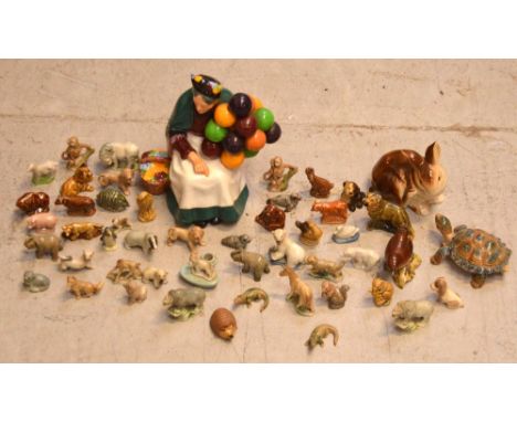 A Royal Doulton figure HN1315, 'The Old Balloon Seller', a Poole rabbit, a Beswick wren and a further quantity of Wade Whimsi