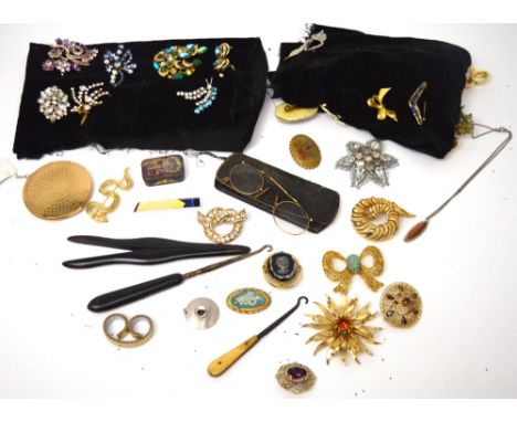 A quantity of costume jewellery to include rhinestone-set brooches, a Stratton compact, a hallmarked silver marquise-shaped p