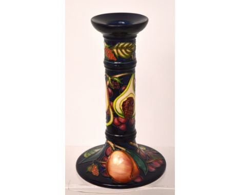 A Moorcroft 'Queen's Pattern' cobalt blue ground candlestick, blue marks to base, 2000, height 21cm.