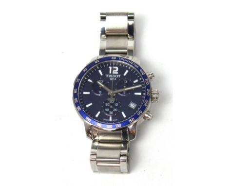 Tissot; a gentlemen's Quickster chronograph watch, circular blue dial set with three subsidiary dials and date aperture on st