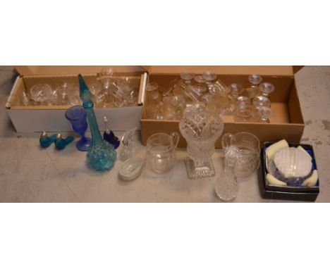 A quantity of glassware to include drinking glasses, a large turquoise decanter etc.