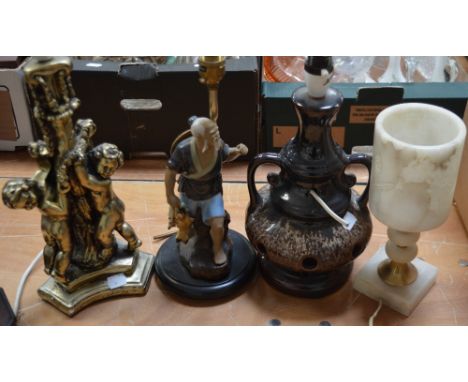 Four table lamps to include a West German ceramic example, a plaster cherubic example, an example modelled as an Oriental gen