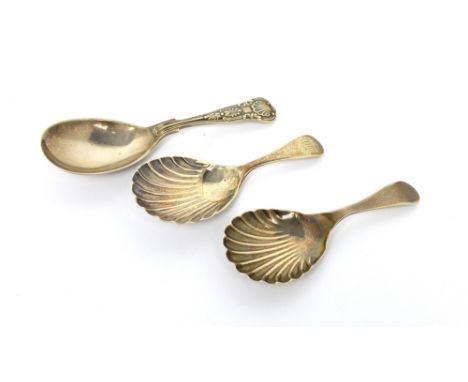 An Edward VII hallmarked silver caddy spoon with shell-shaped bowl, Atking Bros, Sheffield 1908, a further similar example, B