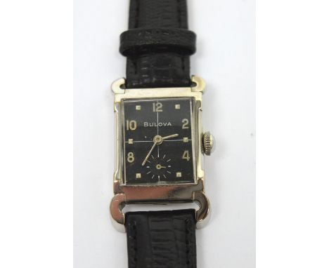 Bulova; a 1956 gentlemen's 'Warwick' tank-style wristwatch, Art Deco style 10ct white gold filled case, black painted dial wi